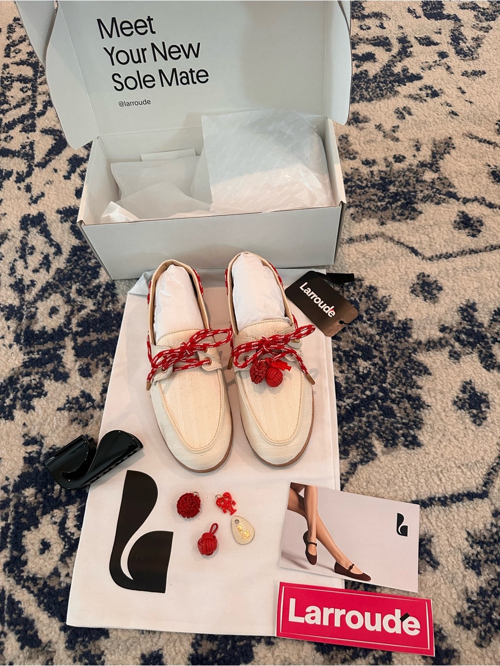 Larroude Cream Loafers with Red Braided Laces and Charms